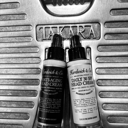 Two bottles of Hardwick & Co head cream on a Takara branded metal surface.