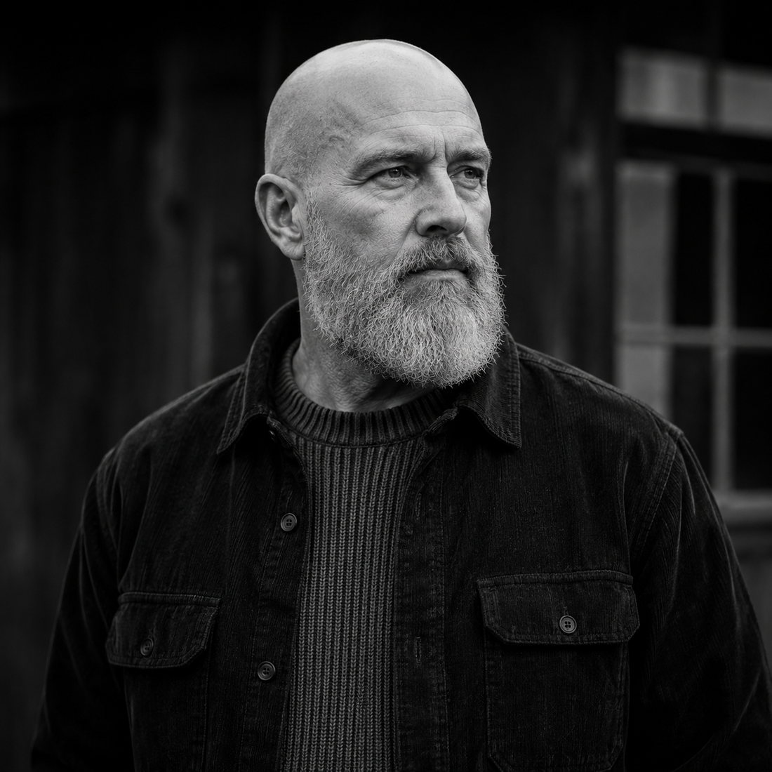Bald man in his fifties with a healthy, well-moisturised scalp in natural light | Hardwick & Co. bald-head anti-ageing advice