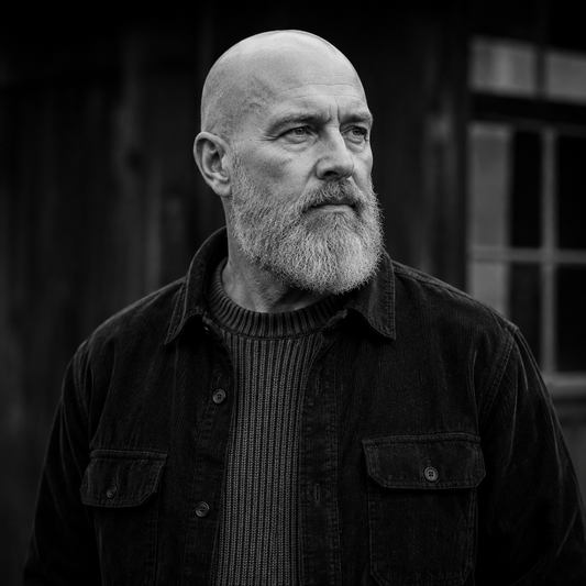 Bald man in his fifties with a healthy, well-moisturised scalp in natural light | Hardwick & Co. bald-head anti-ageing advice