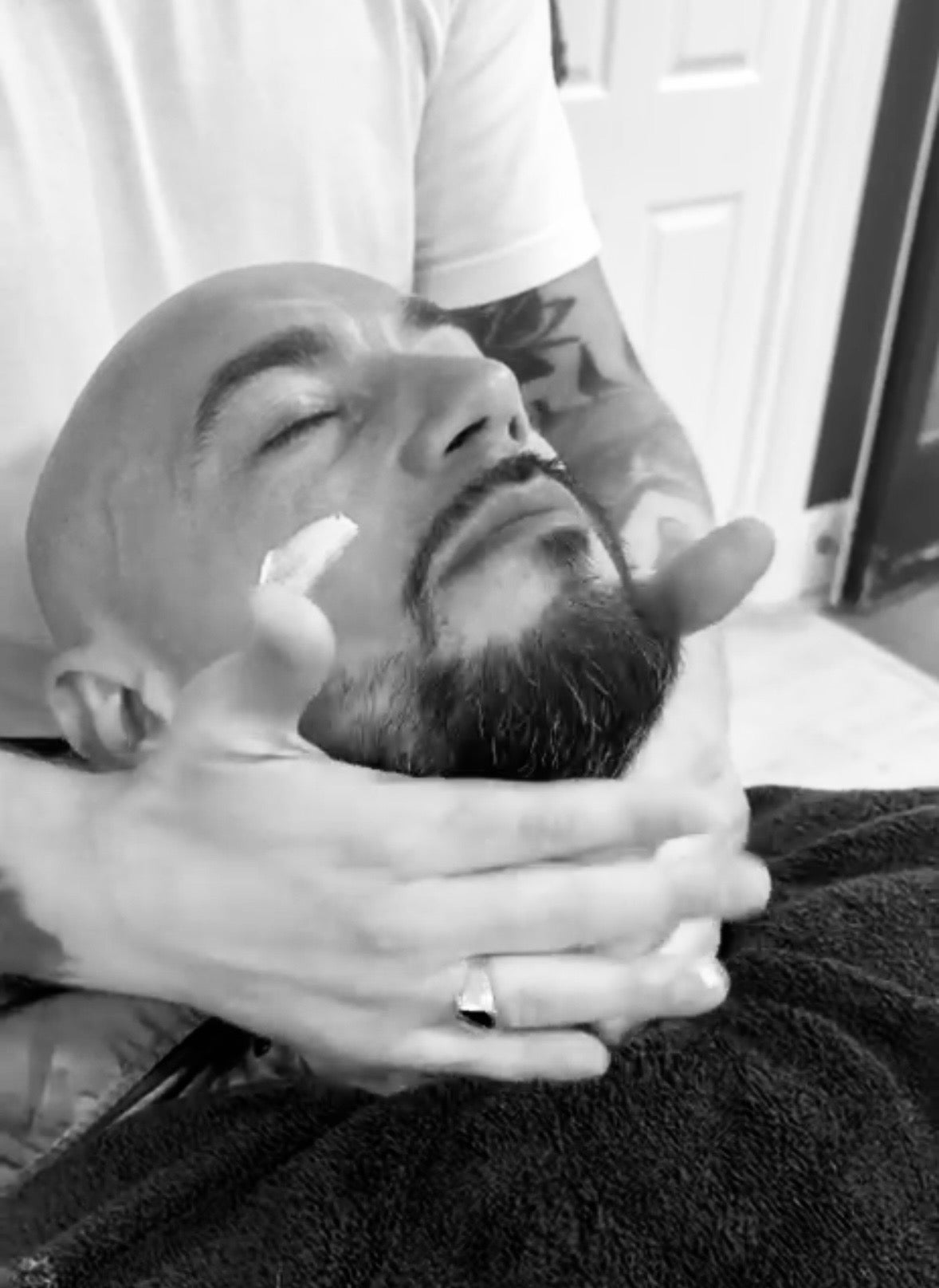 Many having some Hardwick & Co. Anti Aging Head Cream appled to his face during a wet shave