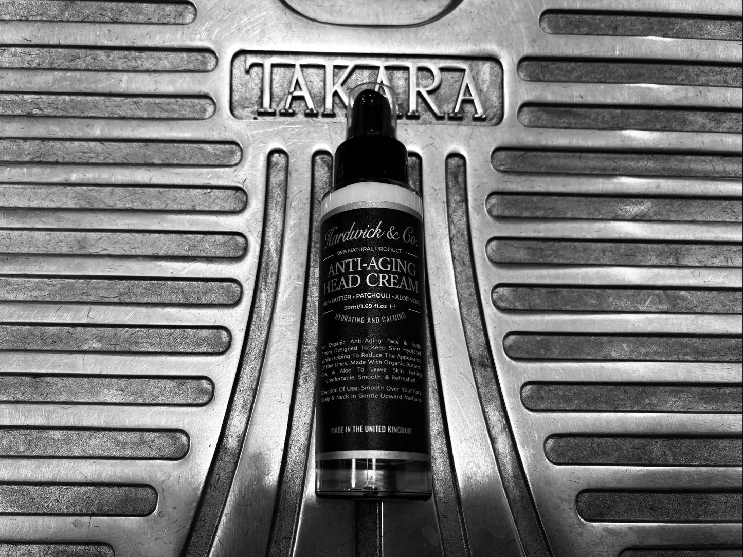 Tube of Hardwick & Co. Anti Aging cream on a metal surface with 'Tatler' branding.